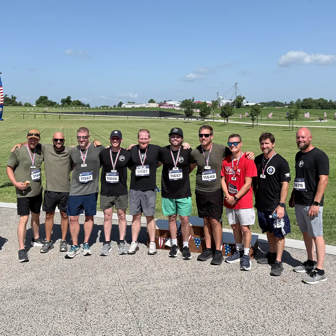Group of Men 5K 1080 Participants pose for a group photo after completing the inaugural Run to Remember 5K & Walk of Remembrance at Missouri's National Veterans Memorial.